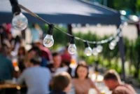 Hanged lamps at outdoor BBQ restaurant &copy; @freepik