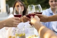 friends-clinking-wine-glasses-close-up &copy; Magnific