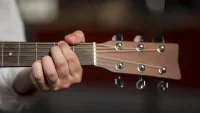 close-up-man-holding-chord-guitar &copy; freepik